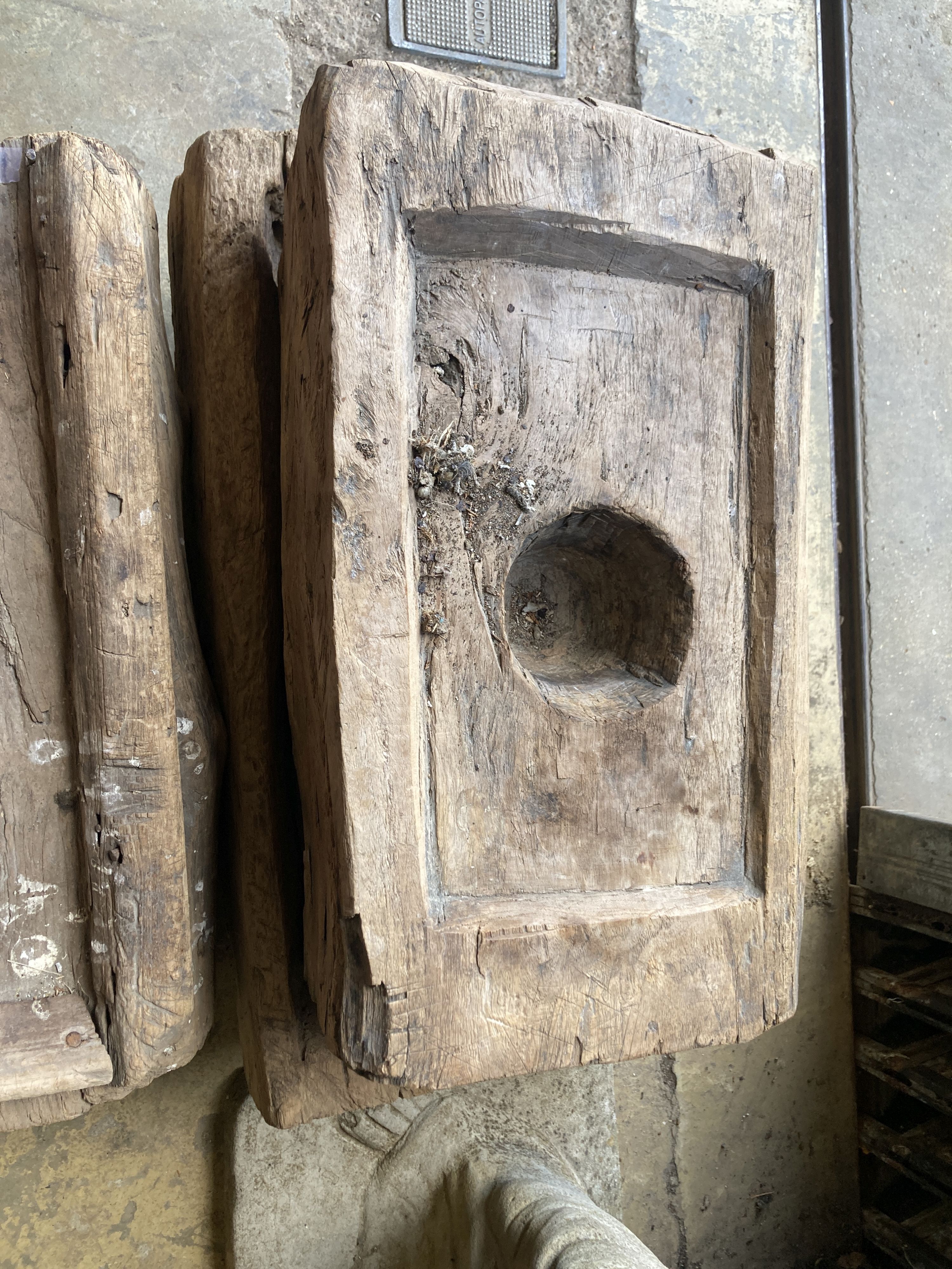 Three Indonesian hardwood rice mortars, largest 60cm, depth 38cm, height 23cm